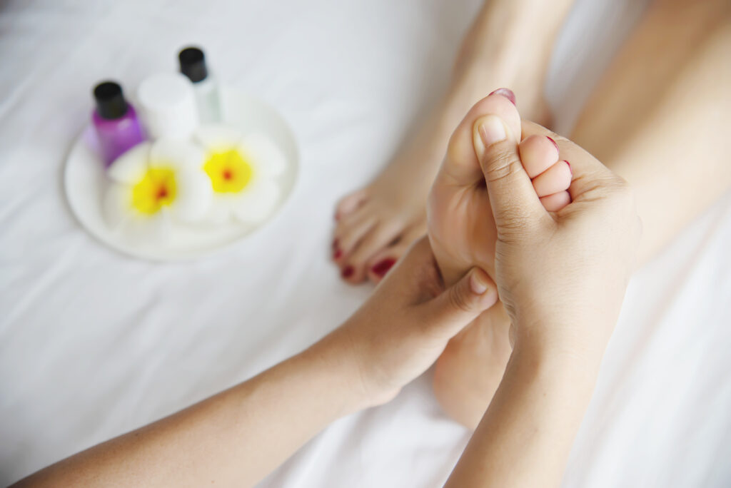 woman-receiving-foot-massage-service-from-masseuse-close-up-hand-foot-relax-foot-massage-therapy-service-concept